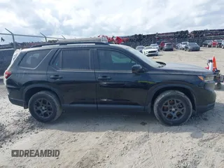 2025 Honda Pilot TrailSport with VIN 5FNYG1H61SB026477, listed as a IAAI auction lot 41471719 with 12,624 mi miles and . Bid and sale history available at DreamBid. Image 13.