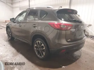 2016 Mazda CX-5 Grand Touring with VIN JM3KE4DY0G0732843, listed as a IAAI auction lot 41520889 with 149,798 mi miles. Bid and sale history available at carsss.com. Image 3.