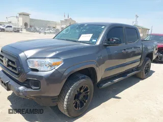 2021 Toyota Tacoma SR with VIN 3TYAX5GN3MT015565, listed as a IAAI auction lot 42241436 with 46,921 mi miles and . Bid and sale history available at DreamBid. Image 2.