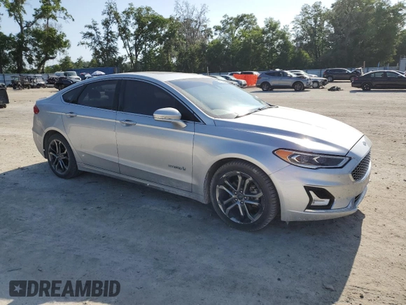 2019 Ford Fusion Titanium with VIN 3FA6P0RU1KR209297, listed as a Copart auction lot 54358065 with 122,600 mi miles and Salvage Title. Bid and sale history available at DreamBid. Image 4.