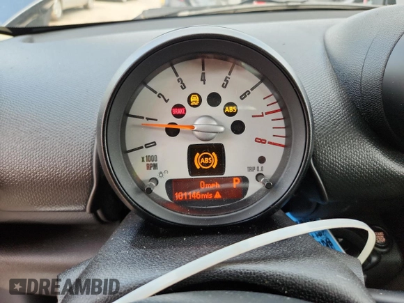 2014 MINI Countryman S with VIN WMWZC3C56EWP25479, listed as a Copart auction lot 61197525 with 101,146 mi miles and Salvage title. Bid and sale history available at DreamBid. Image 9.