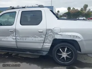 2006 Honda Ridgeline RTL with VIN 2HJYK16556H514349, listed as a IAAI auction lot 42076938 with 215,048 mi miles. Bid and sale history available at carsss.com. Image 6.