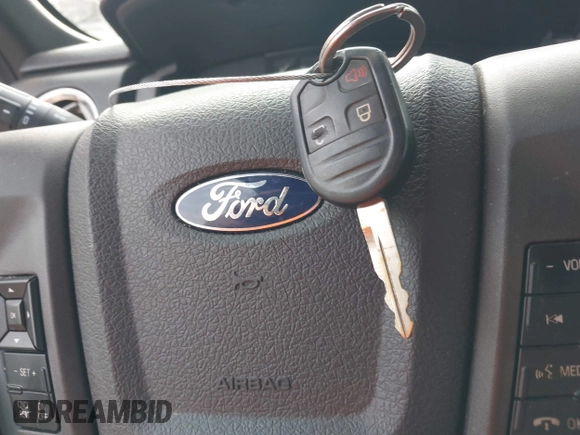 2012 Ford F-150 XL with VIN 1FTFW1CF5CFB63372, listed as a IAAI auction lot 41747703 with 202,219 mi miles. Bid and sale history available at carsss.com. Image 11.