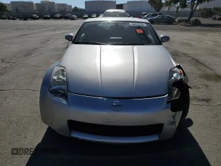 2004 Nissan 350Z Touring z VIN JN1AZ34E94T062960, wystawiony jako Copart lot #55822235 z przebiegiem 186 879 mil mil oraz Szkoda całkowita • Salvage title. Historia ofert i sprzedaży dostępna na DreamBid. Obrazek 5.