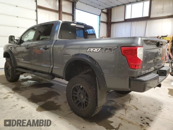 2016 Nissan Titan XD Platinum Reserve with VIN 1N6BA1F44GN503112, listed as a Copart auction lot 81138394 with 143,321 mi miles and Salvage Title. Bid and sale history available at carsss.com. Image 2.