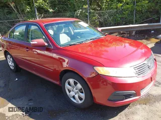 2009 Kia Optima LX z VIN KNAGE228395367017, wystawiony jako IAAI lot #42310556 z przebiegiem 234 760 mil mil oraz . Historia ofert i sprzedaży dostępna na DreamBid. Obrazek 1.