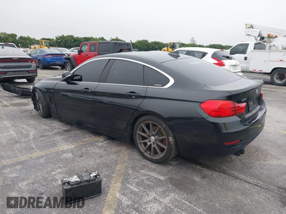 2016 BMW 4 Series 428i xDrive with VIN WBA4C9C58GG136248, listed as a IAAI auction lot 41346270 with 129,464 mi miles and . Bid and sale history available at carsss.com. Image 3.