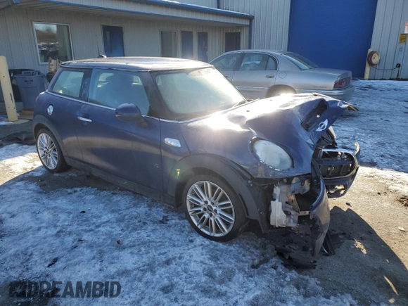 2014 MINI Hardtop S with VIN WMWXM7C51ET986340, listed as a Copart auction lot 42390825 with 71,558 mi miles and Salvage Title. Bid and sale history available at DreamBid. Image 4.
