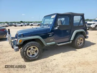 2000 Jeep Wrangler Sport z VIN 1J4FA49S9YP742414, wystawiony jako Copart lot #61471065 z przebiegiem 139 572 mil mil oraz Czysty tytuł • Clean title. Historia ofert i sprzedaży dostępna na DreamBid. Obrazek 1.