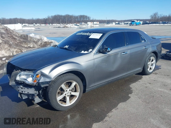 2011 Chrysler 300 with VIN 2C3CA6CTXBH563112, listed as a IAAI auction lot 41374372 with 151,947 mi miles. Bid and sale history available at carsss.com. Image 2.