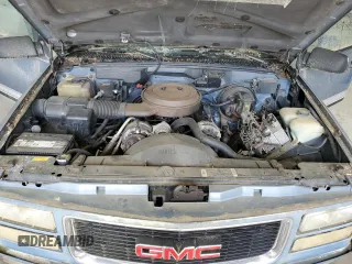 1994 GMC Suburban z VIN 1GKFK16K3RJ725171, wystawiony jako Copart lot #57914635 z przebiegiem 226 183 mil mil oraz Tytuł czysty. Historia ofert i sprzedaży dostępna na DreamBid. Obrazek 12.