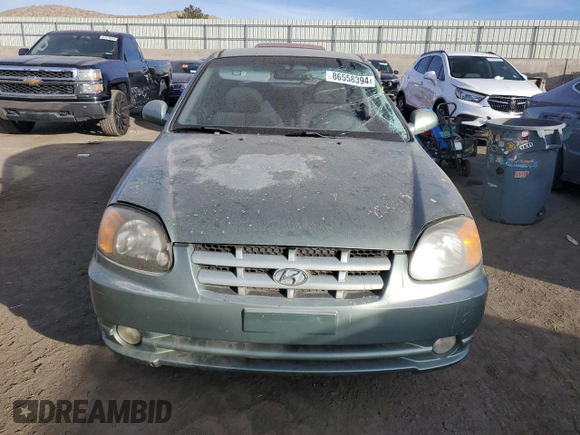 2003 Hyundai Accent GL with VIN KMHCG35CX3U242848, listed as a Copart auction lot 86558394 with 56,248 mi miles and Salvage Title. Bid and sale history available at carsss.com. Image 5.