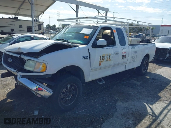 2002 Ford F-150 XL with VIN 1FTRX17L82NA54581, listed as a IAAI auction lot 41698662 with 220,321 mi miles. Bid and sale history available at carsss.com. Image 2.
