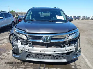 2021 Honda Pilot Touring 8-Passenger with VIN 5FNYF6H97MB034399, listed as a IAAI auction lot 42303419 with 50,034 mi miles and . Bid and sale history available at DreamBid. Image 13.