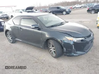 2015 Scion tC with VIN JTKJF5C7XFJ001662, listed as a IAAI auction lot 41843123 with 128,851 mi miles. Bid and sale history available at carsss.com. Image 1.