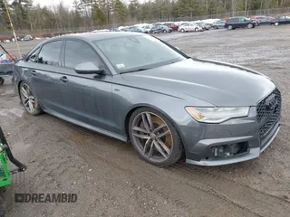 2016 Audi S6 Prestige z VIN WAUH2AFC8GN010001, wystawiony jako IAAI lot #41719620 z przebiegiem 107 833 mil mil oraz . Historia ofert i sprzedaży dostępna na DreamBid. Obrazek 1.