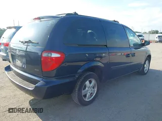 2005 Dodge Caravan SXT with VIN 2D4GP44L65R565519, listed as a IAAI auction lot 42730269 with 124,848 mi miles and . Bid and sale history available at DreamBid. Image 4.
