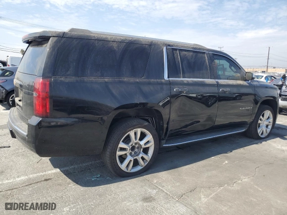 2017 Chevrolet Suburban Premier with VIN 1GNSCJKC0HR140111, listed as a Copart auction lot 74387664 with 104,094 mi miles and Salvage Title. Bid and sale history available at carsss.com. Image 3.