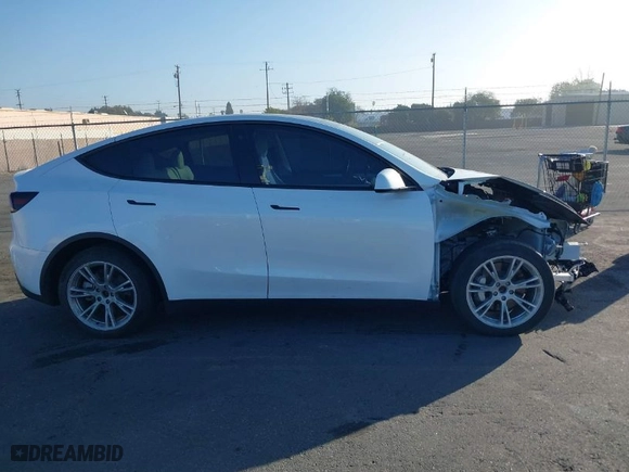 2023 Tesla Model Y Long Range with VIN 7SAYGDEE9PF618720, listed as a IAAI auction lot 41643062 with NaN miles. Bid and sale history available at carsss.com. Image 14.