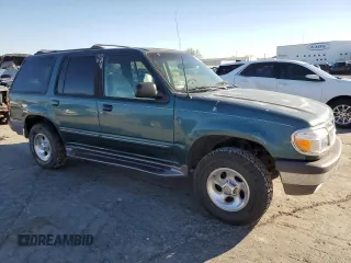 1997 Ford Explorer XL with VIN 1FMDU34E2VZC03015, listed as a Copart auction lot 80654764 with 295,587 mi miles and Salvage title. Bid and sale history available at DreamBid. Image 4.