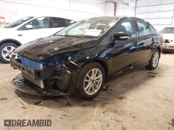 2018 Ford Focus SE with VIN 1FADP3F23JL215479, listed as a IAAI auction lot 41936036 with 96,560 mi miles. Bid and sale history available at carsss.com. Image 2.