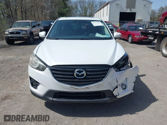 2016 Mazda CX-5 Grand Touring with VIN JM3KE4DY0G0632693, listed as a IAAI auction lot 42123142 with 106,592 mi miles. Bid and sale history available at carsss.com. Image 12.