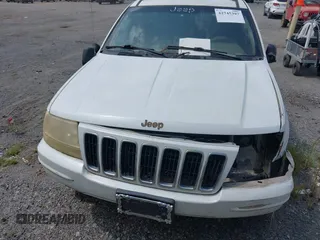 2002 Jeep Grand Cherokee Limited z VIN 1J4GX58N62C195783, wystawiony jako IAAI lot #42745397 z przebiegiem 242 502 mil mil oraz . Historia ofert i sprzedaży dostępna na DreamBid. Obrazek 6.