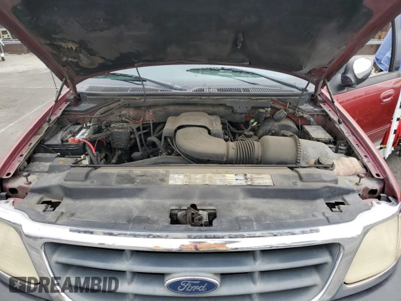 2001 Ford F-150 XLT with VIN 1FTRW07WX1KE51166, listed as a Copart auction lot 60164025 with 157,035 mi miles and Salvage title. Bid and sale history available at DreamBid. Image 11.