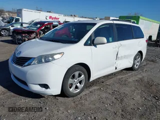 2014 Toyota Sienna LE AAS with VIN 5TDKK3DC6ES489789, listed as a IAAI auction lot 41899933 with 81,090 mi miles and . Bid and sale history available at DreamBid. Image 2.