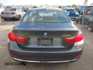2014 BMW 4 Series 428i with VIN WBA3N7C5XEF719384, listed as a IAAI auction lot 41694678 with 115,517 mi miles and . Bid and sale history available at carsss.com. Image 16.