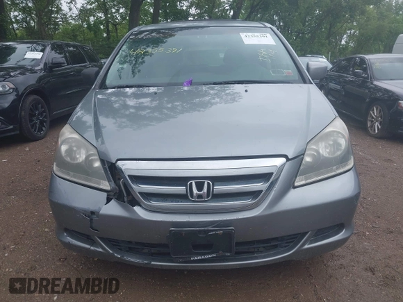 2007 Honda Odyssey EX z VIN 5FNRL38407B084436, wystawiony jako IAAI lot #42355391 z przebiegiem 144 607 mil mil oraz . Historia ofert i sprzedaży dostępna na DreamBid. Obrazek 13.