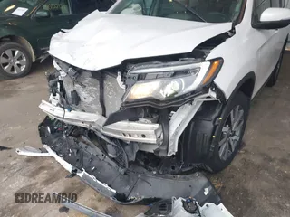 2022 Honda Pilot EX-L with VIN 5FNYF6H58NB097283, listed as a IAAI auction lot 40944566 with 22,027 mi miles and . Bid and sale history available at carsss.com. Image 6.