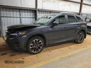 2016 Mazda CX-5 Grand Touring z VIN JM3KE2DY6G0731605, wystawiony jako Copart lot #88536565 z przebiegiem 106 306 mil mil oraz Szkoda całkowita • Salvage title. Historia ofert i sprzedaży dostępna na DreamBid. Obrazek 1.