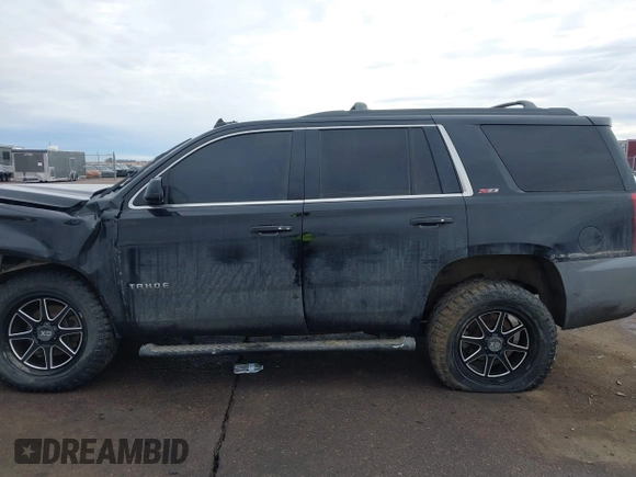 2017 Chevrolet Tahoe LT with VIN 1GNSKBKC7HR178685, listed as a IAAI auction lot 41466840 with 163,610 mi miles and . Bid and sale history available at DreamBid. Image 14.