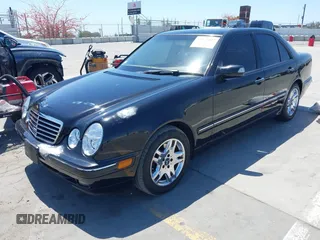 2002 Mercedes-Benz E-Class with VIN WDBJF65J62B404868, listed as a IAAI auction lot 42121837 with 107,415 mi miles. Bid and sale history available at carsss.com. Image 2.