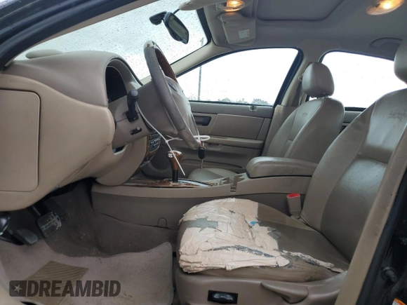 2003 Ford Taurus SEL Deluxe with VIN 1FAHP56S83A225002, listed as a Copart auction lot 49456975 with 199,759 mi miles and Salvage Title. Bid and sale history available at DreamBid. Image 7.