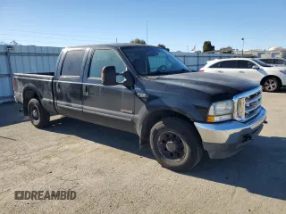 2003 Ford Super Duty F-250 XL with VIN 1FTNW20P23EB90968, listed as a Copart auction lot 41882395 with 215,373 mi miles and Salvage Title. Bid and sale history available at carsss.com. Image 4.