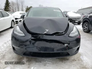 2021 Tesla Model Y Long Range z VIN 5YJYGDEE6MF089008, wystawiony jako Copart lot #45304715 z przebiegiem 140 761 mil mil oraz Szkoda całkowita • Salvage title. Historia ofert i sprzedaży dostępna na DreamBid. Obrazek 5.