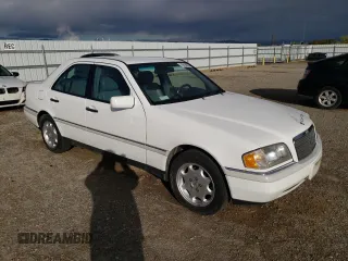 1995 Mercedes-Benz C with VIN WDBHA28E1SF151911, listed as a Copart auction lot 76814424 with 128,184 mi miles and Clean Title. Bid and sale history available at carsss.com. Image 4.