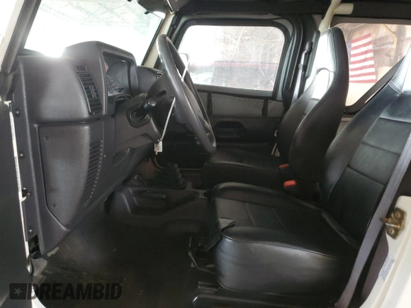 2002 Jeep Wrangler SE with VIN 1J4FA29P12P700276, listed as a Copart auction lot 45109175 with 115,139 mi miles and Salvage Title. Bid and sale history available at DreamBid. Image 7.