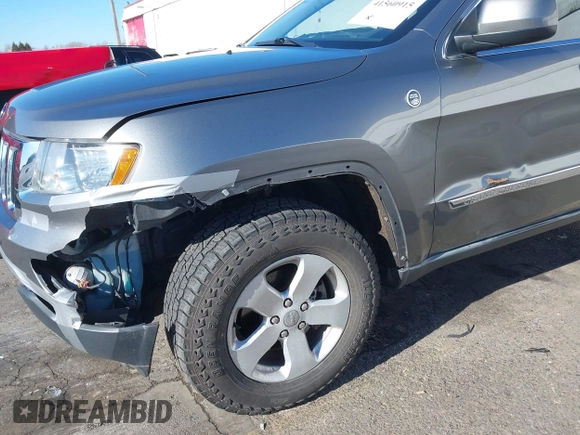 2011 Jeep Grand Cherokee Laredo with VIN 1J4RR4GG9BC714325, listed as a IAAI auction lot 41560915 with 153,372 mi miles and . Bid and sale history available at DreamBid. Image 6.