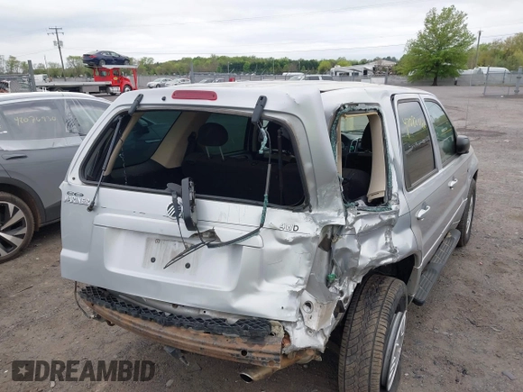 2005 Mercury Mariner Convenience z VIN 4M2YU57Z55DJ18600, wystawiony jako IAAI lot #42082068 z przebiegiem 141 530 mil mil oraz . Historia ofert i sprzedaży dostępna na DreamBid. Obrazek 6.