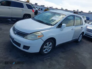 2007 Nissan Versa 1.8 S with VIN 3N1BC11E47L439072, listed as a IAAI auction lot 42083801 with 215,096 mi miles. Bid and sale history available at carsss.com. Image 12.