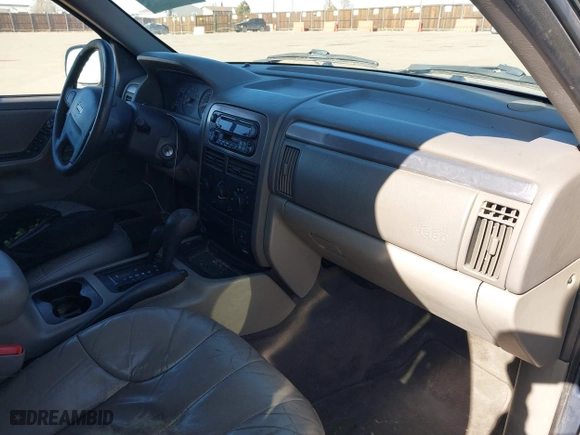 2001 Jeep Grand Cherokee Laredo with VIN 1J4GW48N11C558857, listed as a IAAI auction lot 41527331 with 187,513 mi miles. Bid and sale history available at carsss.com. Image 5.