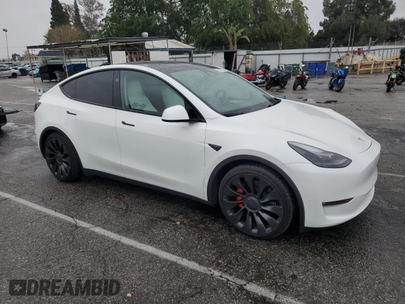 2023 Tesla Model Y Performance with VIN 7SAYGDEF1PF809654, listed as a Copart auction lot 43981915 with 16,401 mi miles and Salvage Title. Bid and sale history available at DreamBid. Image 4.