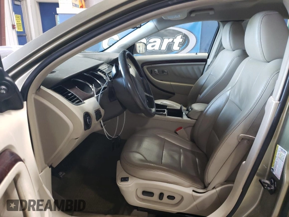 2012 Ford Taurus Limited with VIN 1FAHP2JW3CG142762, listed as a Copart auction lot 77864584 with 131,911 mi miles and Salvage title. Bid and sale history available at DreamBid. Image 7.