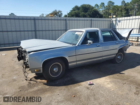 1989 Ford Crown Victoria z VIN 2FABP74F2KX141884, wystawiony jako Copart lot #74934494 z przebiegiem 84 761 mil mil oraz Szkoda całkowita • Salvage title. Historia ofert i sprzedaży dostępna na DreamBid. Obrazek 1.