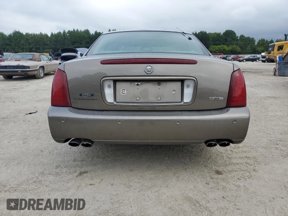 2000 Cadillac DeVille DTS z VIN 1G6KF5794YU249059, wystawiony jako Copart lot #71614494 z przebiegiem 121 611 mil mil oraz Szkoda całkowita • Salvage title. Historia ofert i sprzedaży dostępna na DreamBid. Obrazek 6.
