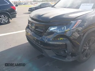 2022 Honda Pilot Special Edition with VIN 5FNYF5H25NB026414, listed as a IAAI auction lot 42590493 with 26,600 mi miles and . Bid and sale history available at DreamBid. Image 6.