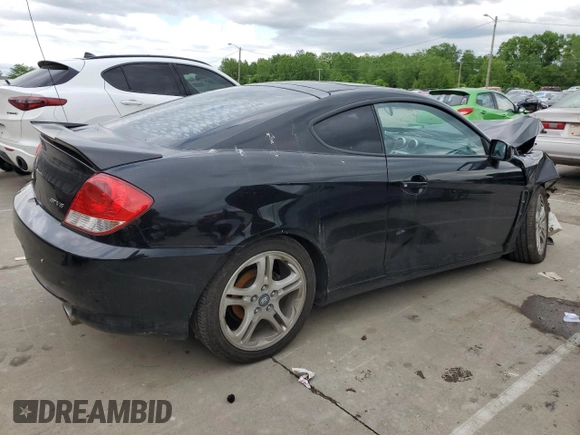 2006 Hyundai Tiburon GT z VIN KMHHN65F66U215304, wystawiony jako Copart lot #56141635 z przebiegiem 149 118 mil mil oraz Szkoda całkowita • Salvage title. Historia ofert i sprzedaży dostępna na DreamBid. Obrazek 3.